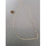 A 9ct gold chain together with a 9ct gold signet ring, size L/M, gross wt. 4.2g.