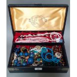 A Chinese style jewellery box and contents including beads, lapis lazuli, malachite etc.