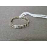 A hallmarked 9ct white gold half hoop diamond eternity ring, gross wt. 3.2g, size R.