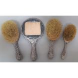 A selection of silver bound items to include 3 brushes and a mirror - AF.