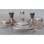 A selection of silver items including pair of candlesticks, various cut glass jars with silver lids,