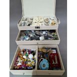 A jewellery box containing costume jewellery to include some silver and various watches.