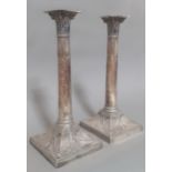 A pair of silver Corinthian column candlesticks, Thomas Bradbury & Sons Ltd, London, 1913, height