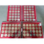 Four coin presentation trays containing assorted commemorative crowns & £5 coins.