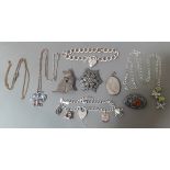 A mixed lot of silver jewellery to include chains with pendants, bracelets, brooches, gross wt.