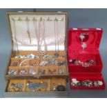 Two jewellery boxes containing costume jewellery, earrings, brooches, necklaces, etc.