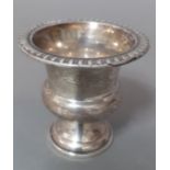 A silver miniature urn, marked 925 together with a silver napkin ring, gross wt. 2.3ozt.