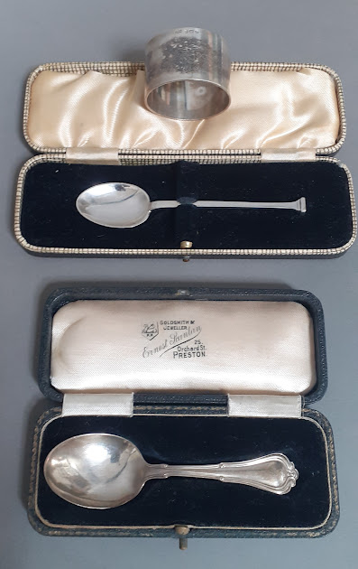 Two cased silver christening spoons together with a solid silver napkin ring, various marks, gross