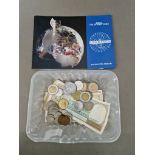 A collection of assorted world coins and banknotes.