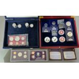 Two coin presentation boxes with contents to include 3 x United States proof sets, 2 x Danbury....
