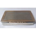 A silver and gilt box, marked 900, with inscription 'VEMD from DLB, 51,990 miles, 1949-1951'.