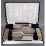 A silver bound dressing table set, in original box, Birmingham, Davis, Moss & Co, 1931 / 1932.