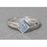 A 9ct white gold diamond and blue topaz ring, size T/U, gross wt. 2.4g.