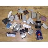 A tin of various vintage lighters, etc.