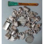 A silver charms bracelet, gross wt. 92g together with a cheroot holder.