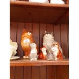 Two Royal Doulton cats and four Beswick cats.