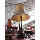A brass and pottery column table lamp with shade, height 65cm.