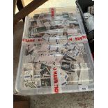 A large crate of loose cigarette/tea cards