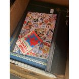 A box of stamp albums and covers.