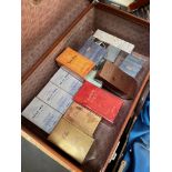 A vintage case containing assorted perfumes, mainly Yves Rocher.