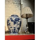 A table lamp and a blue and white vase.