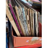 A box of vinyl LP records.