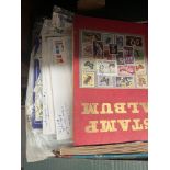 A box of stamps in albums and first day covers