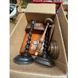 A box of treen to include a cat door stop, tea caddy, 2 barley twist candlesticks and a letter