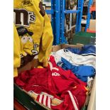 A collection of football shirts including Manchester United, Barcelona, Blackburn Rovers, Real