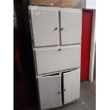 A painted aluminium kitchenette cabinet.