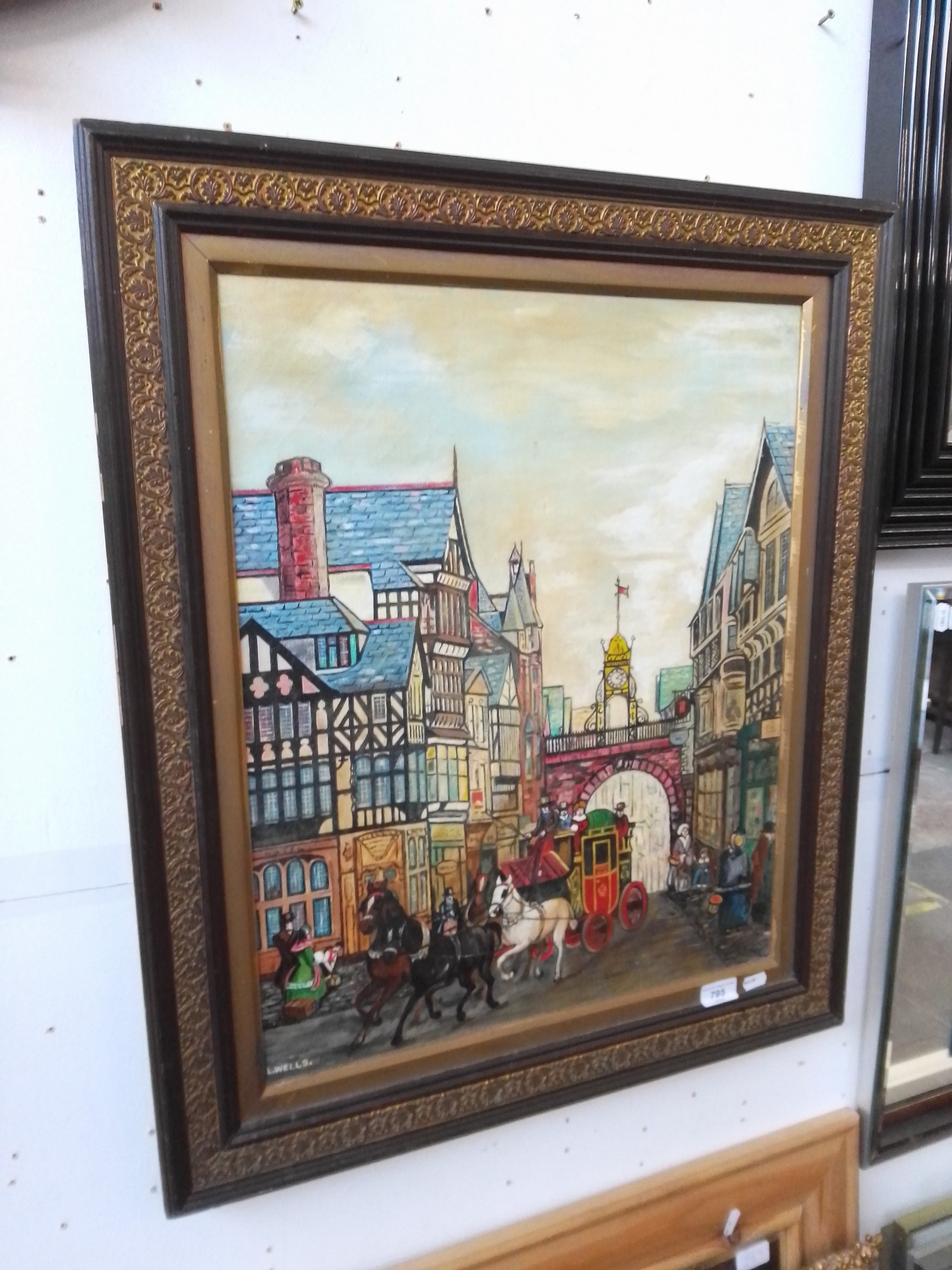 L. Wells, street scene, oil on canvas, 46cm x 48cm.