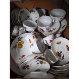 Royal Worcester ‘Evesham’ dinner wares including oval plates, dinner plates, soup coupes & stands