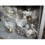 A box of metal-ware, mainly brass, ornaments, weights, kettle, door stops, etc.