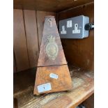 A walnut cased metronome.