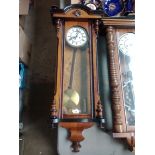 A late 19th century double weight driven walnut cased Vienna wall clock.