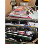 A box containing vintage and modern theatre programmes mostly with tickets, together with various