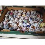 A collection of Porcelain Art miniature teapots.