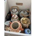 A box of oriental ceramics including teapots, lidded jars etc