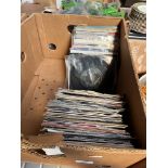 A box of 7" singles.