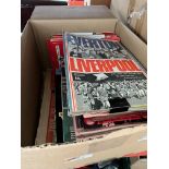 A box of Liverpool FC football programmes.