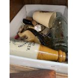 A box of mixed collectables including watches, glass, stoneware bottle, brass etc