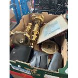 A box of miscellaneous items include a pair of brass table lights / candles, binoculars, barometer.