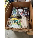 A box of football programmes.