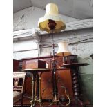 An Arts & Crafts style wrought iron and copper adjustable lamp.