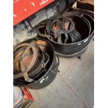 Collection of cast iron cauldrons and three trivets.