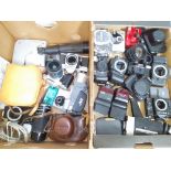 Two boxes of assorted cameras and accessories.