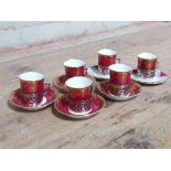 A set of six hallmarked silver mounted Paragon coffee cans and saucers, (two with non matching