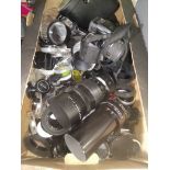 A box of assorted cmaera accessories comprising a large quantity of filters and lens cpas, a