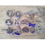 A collection of military sweetheart badges including silver, RAF etc.