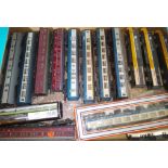 A box of model railway coaches and HST dummy carts, all 00 gauge.
